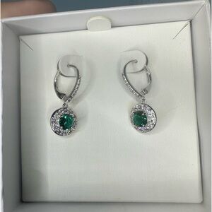Lab created dark emerald and white topaz on a triple rhodium plated earring set